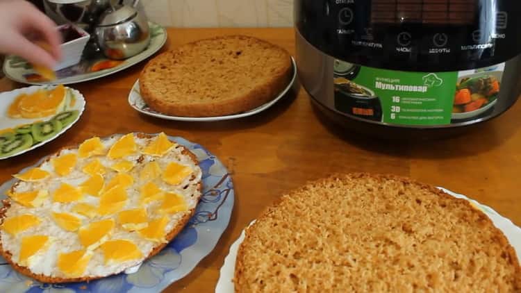 To prepare a honey cake in a slow cooker, coat the cakes with cream