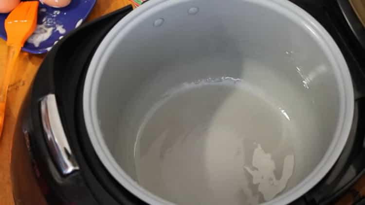 To prepare a honey cake in a slow cooker, prepare a baking bowl