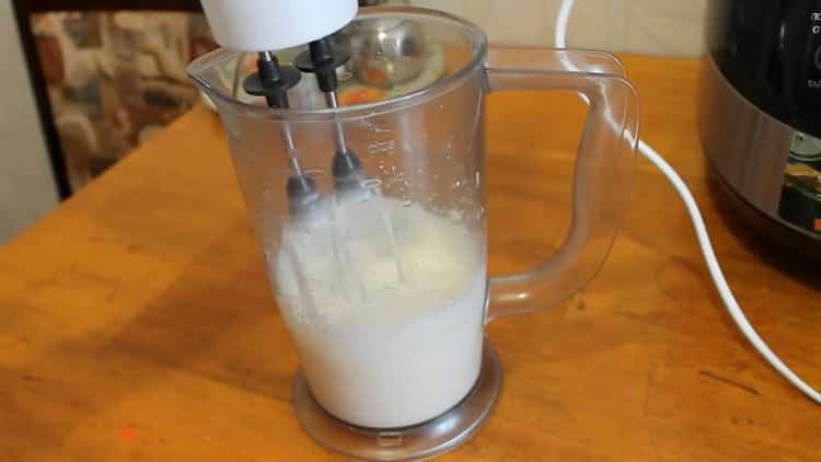 To make a honey cake in a slow cooker, beat the ingredients for the cream