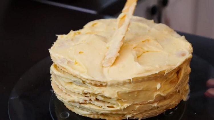 To make Napoleon cake with custard, lay out the cakes and spread them