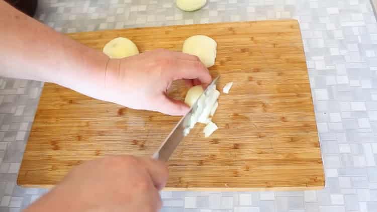 To cook beef in pots with potatoes in the oven, chop the ingredients