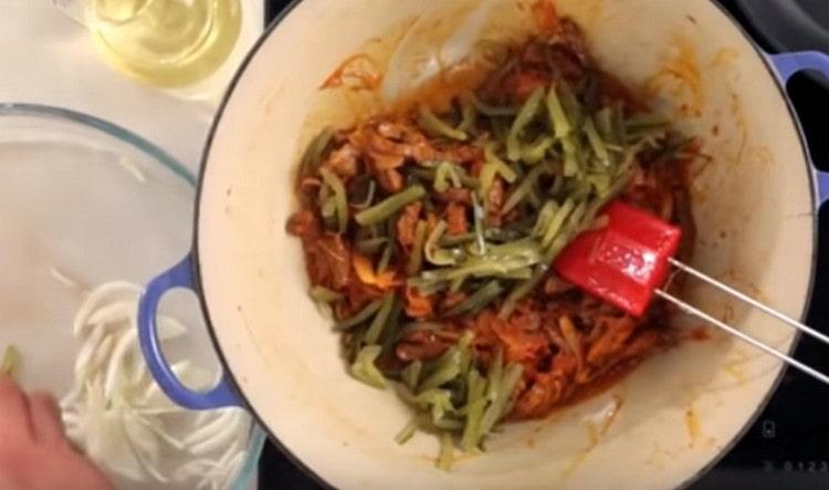 Add pickles to the dish.