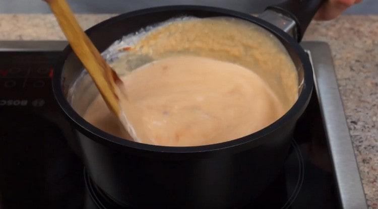 Add nutmeg, tomato paste to the sauce and cook for a few more minutes.