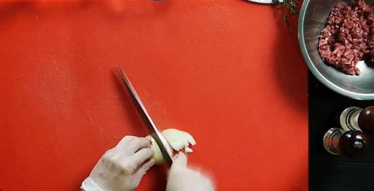 To cook beef steaks, chop the onion