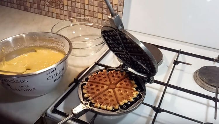 Bake waffle cookies on both sides.