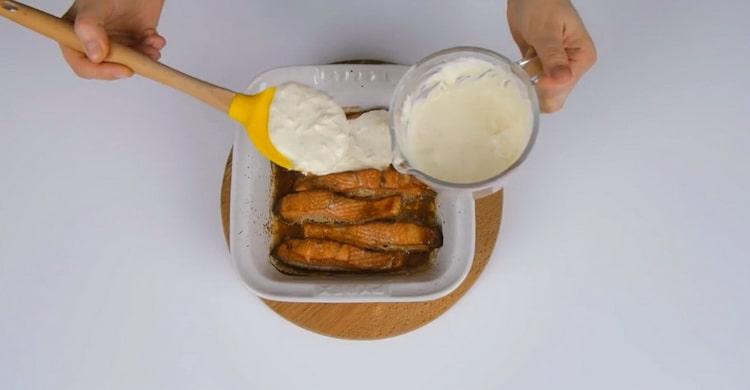 To cook pink salmon in the oven, preheat the oven