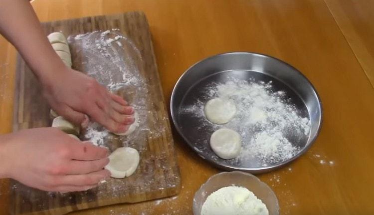 We press each blank into a kind of medallion.