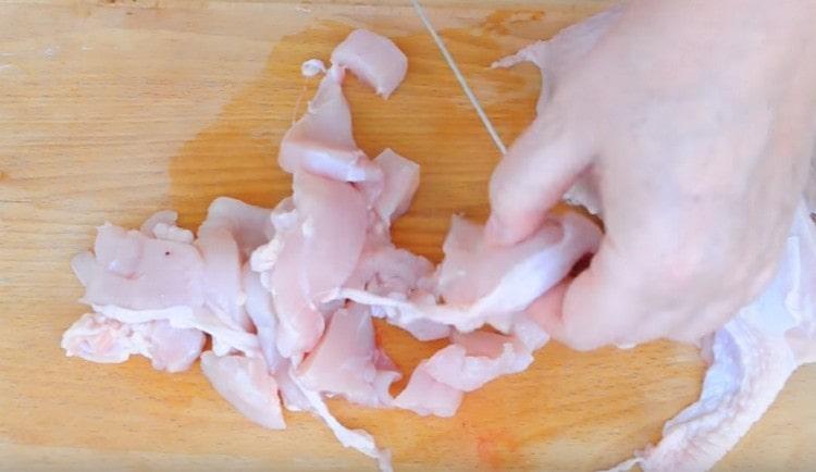 Cut the chicken into small pieces.
