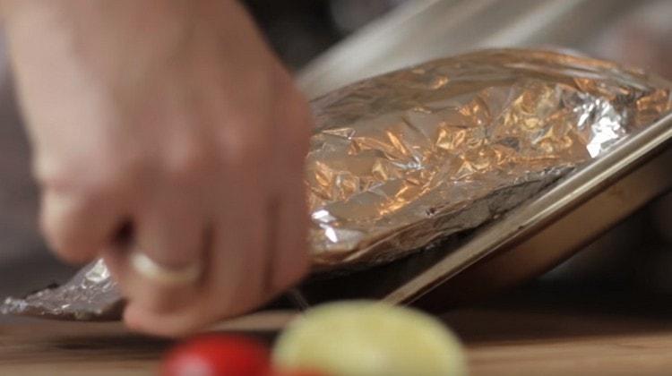 After baking, carefully transfer the fish to the board.