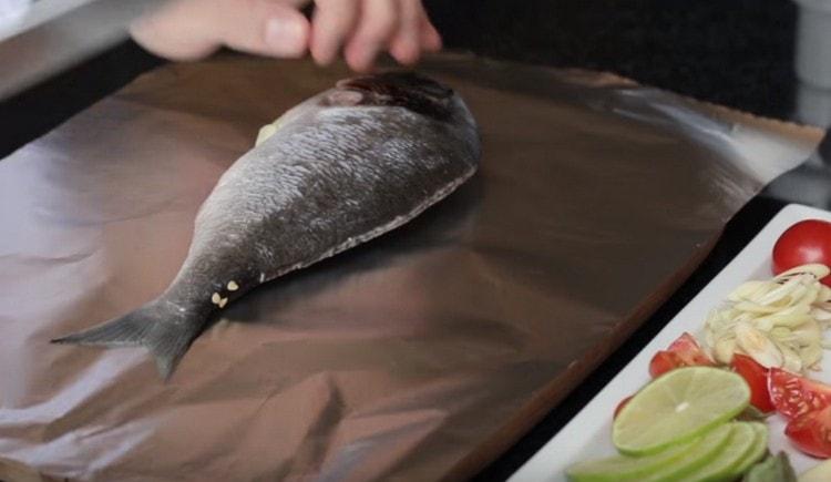 Put the fish on the foil.