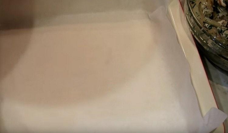 We cover the baking dish with parchment.