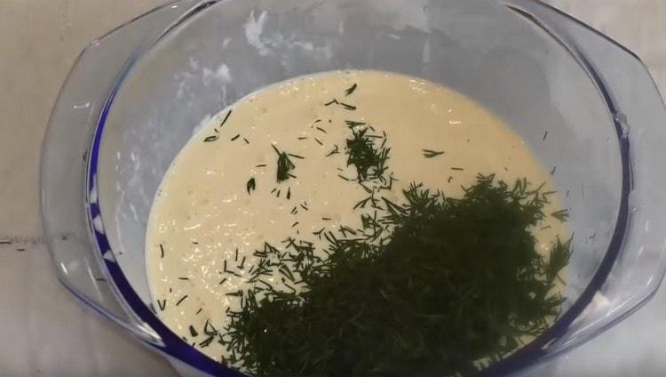 Add chopped fresh dill to the sour cream and egg mass.