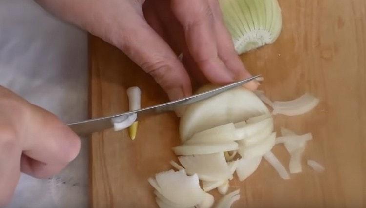Onion cut into half rings.