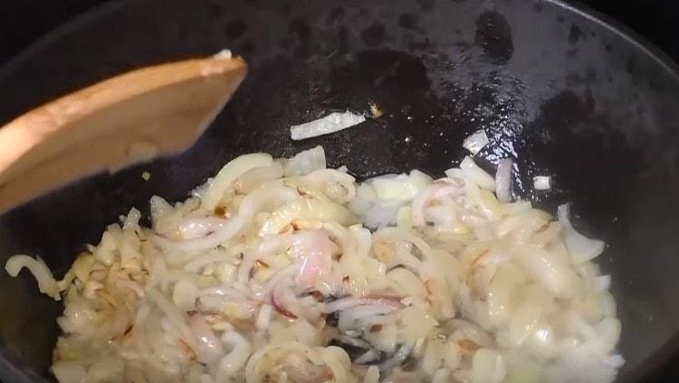 Fry chopped onion until golden brown.