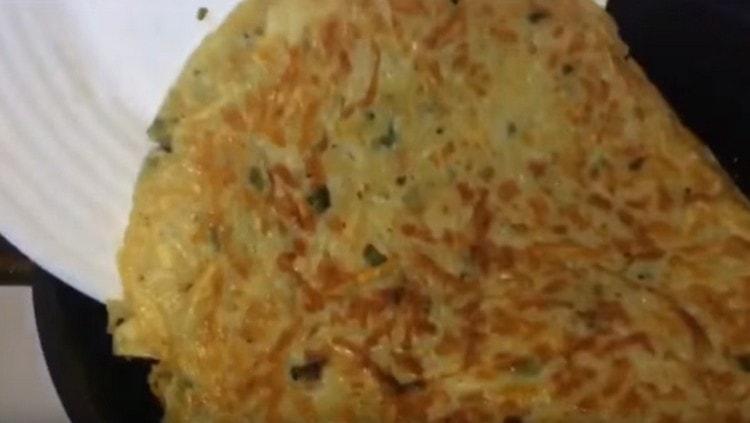 Gently turn the cake to the other side.