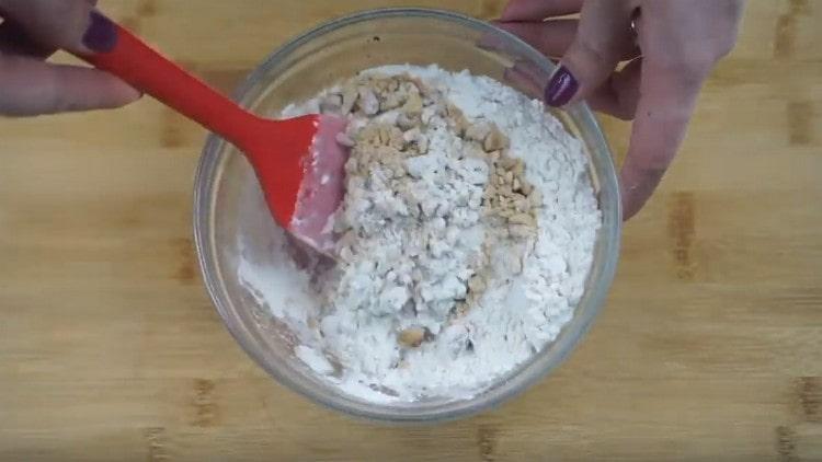 Add sugar and flour to the nuts.