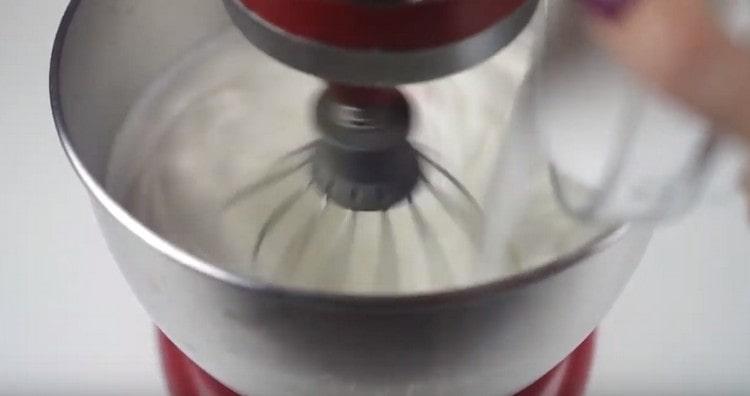 Slowly introduce sugar into the proteins and beat until stable peaks.