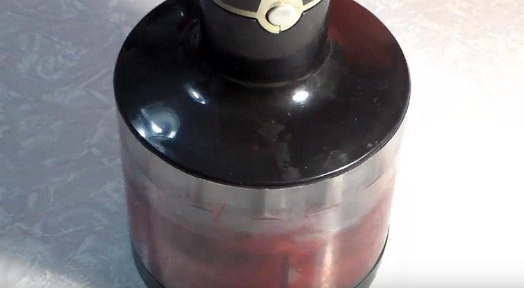 We interrupt fruit with berries with a blender.