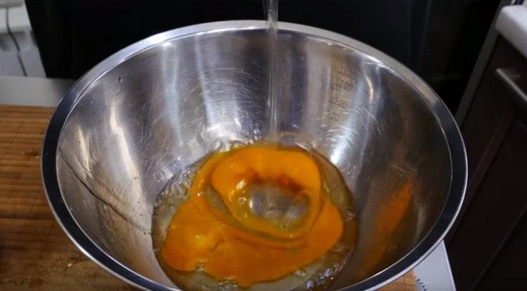 Knock out two eggs in a bowl.