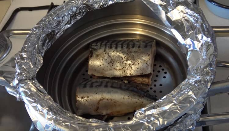 We spread the pieces of fish in a makeshift smokehouse.