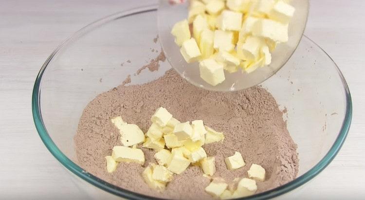 Add the sliced cold butter to the dry ingredients.