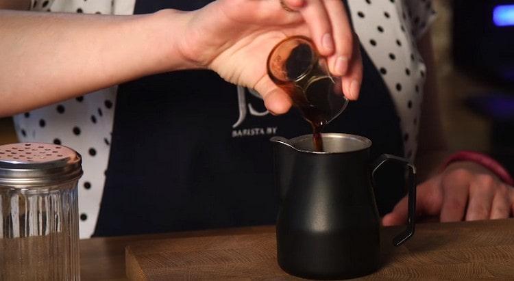 We add water and chocolate syrup to coffee.