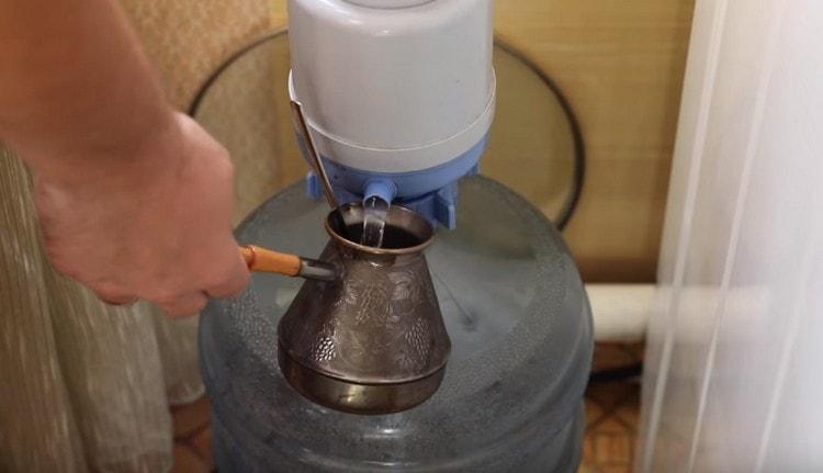 Pour water into the Turk.