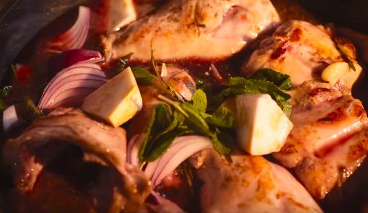 Add red wine to the pan, as well as vegetable broth.