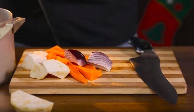 Large cut carrots, onions, celery root.