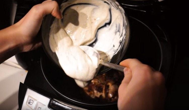 The resulting sauce is added to the meat with onions in a slow cooker.