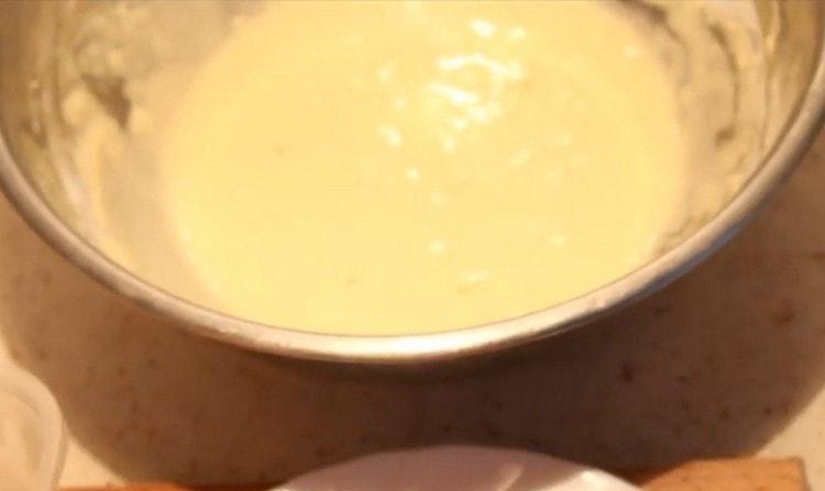 With a whisk, mix the batter, achieving a homogeneous consistency.