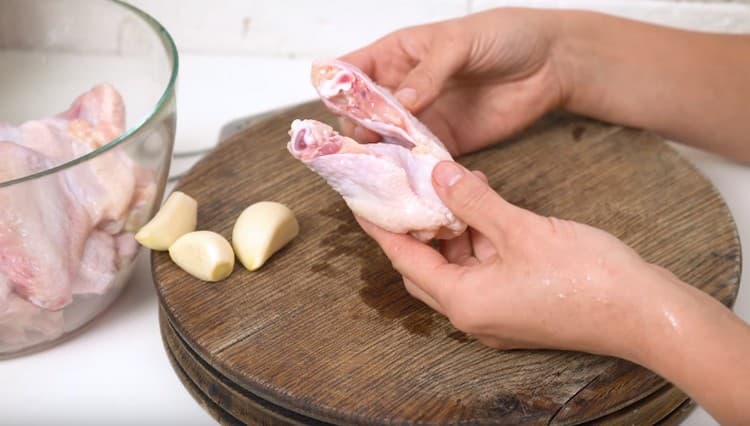 Wings are well washed, if desired, cut into two parts.