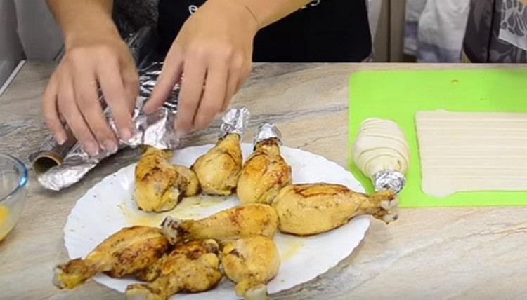 The bones of the legs are wrapped with foil.