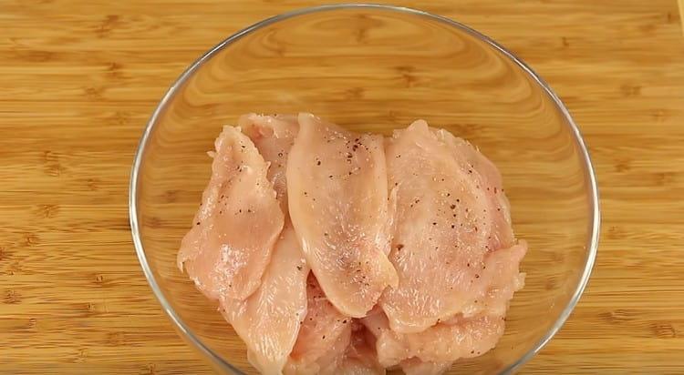 Salt and pepper the chicken.