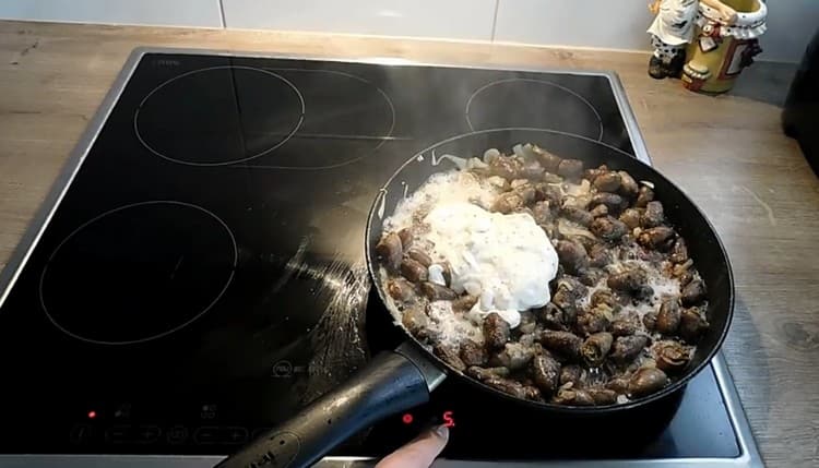 Add sour cream mixed with Dijon mustard to the pan, as well as flour.