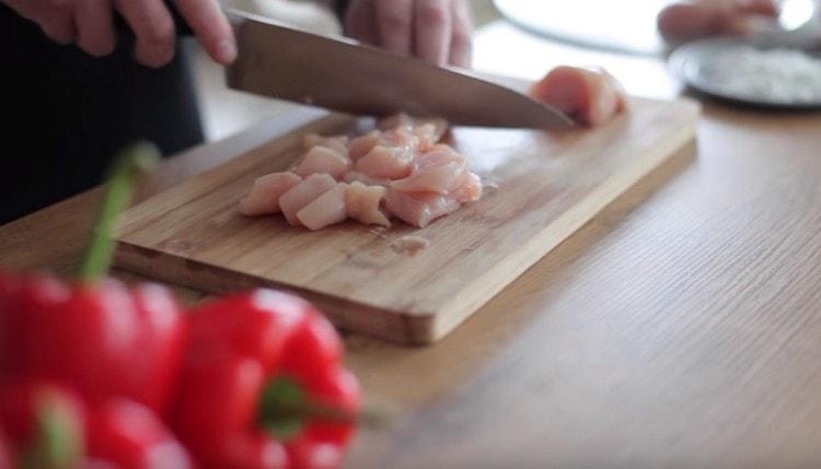 Cut the chicken into pieces.