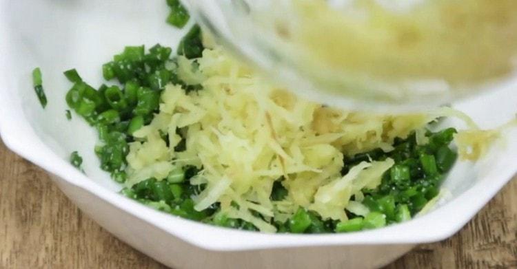 Add grated ginger to the onion.