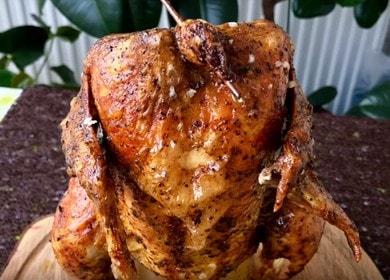 Appetizing chicken on a bottle in the oven: cook according to the recipe with a photo.