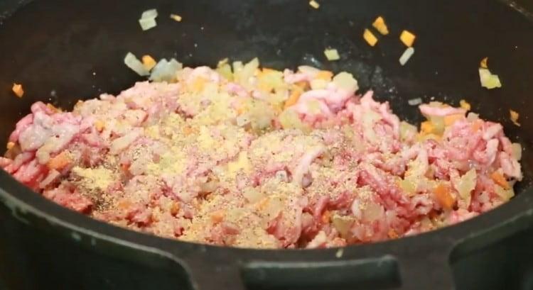 Season the future Bolognese sauce with spices.