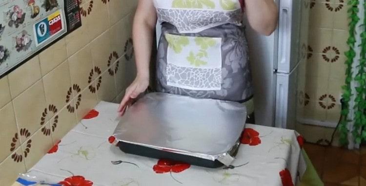 Cover the form with foil and send to the oven.