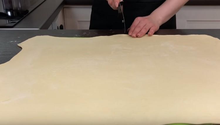 Cut the rolled dough in half.