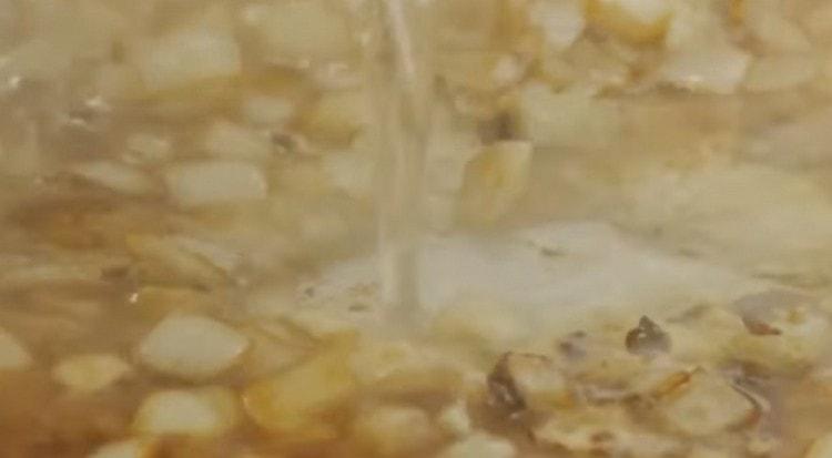 Stir onion until soft and add the broth.