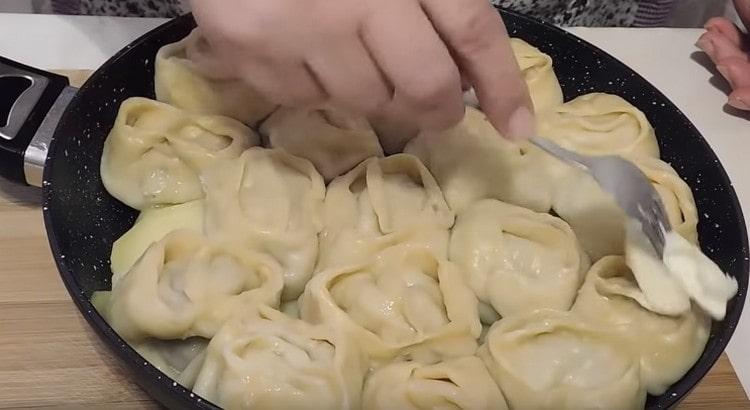 Ready manti needs to be greased with butter.