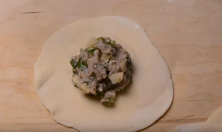 On the center of each cake spread the stuffing.