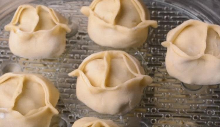 put manti in a greased bowl of a pressure cooker or a double boiler