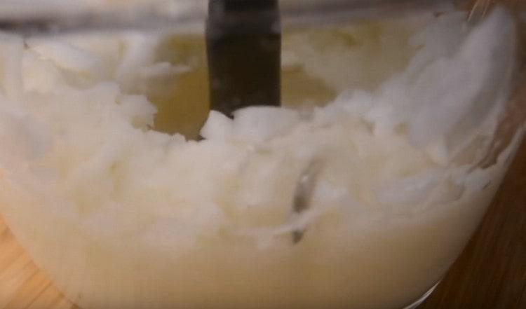 Grind onion in a blender or grinder.