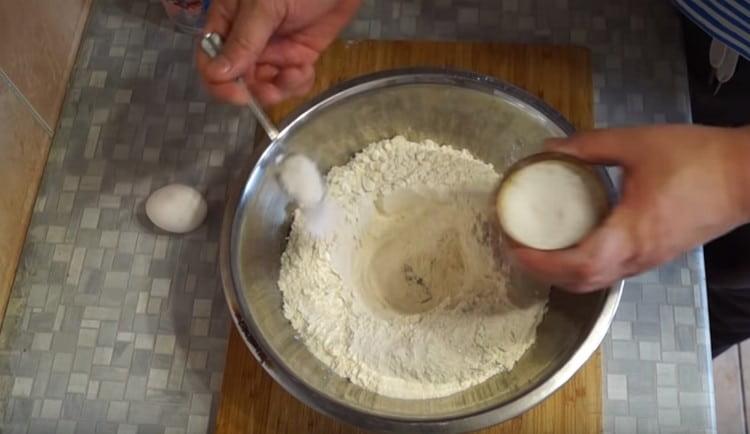 Sift the flour for the dough, add salt to it.
