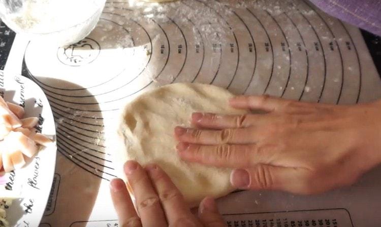 Gently stretch each piece of dough with your hands.