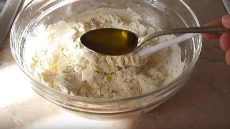 Knead the dough and add olive oil to it.