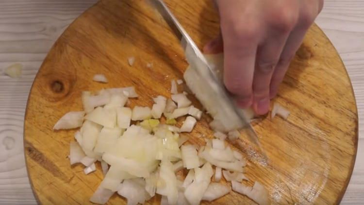 Cut the carrots into circles and chop the onion.